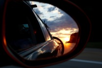 Beautiful sunrise in the sideview mirror.