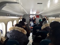 Fellow ski plane passengers all packed in tightly