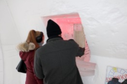 Bryan and Nicole purchasing their Snowking passes at the ticket booth in the Snowking Castle